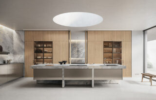 Lignum Et Lapis kitchen with Vintage Stainless Steel suspended island cabinetry, polished Versilys grey marble, and Natural Oak Slatted doors