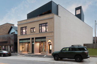 Back brick facade of Allen Apartments.