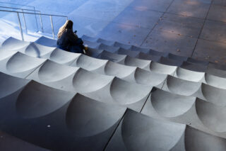 Stone stairs with decorative geometric curves.