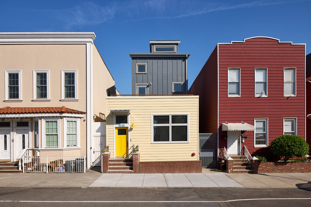 Exterior of yellow residential.