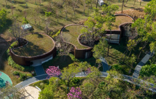 Aerial shot of Qiaochengbei Park Visitor Center east building, with tons of greenery.