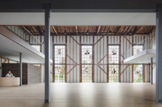 Interior church airy view of Church with wooden beams and glass panels.