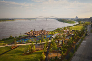 View of Tom Lee Park and the waterfront, bridge in the background.