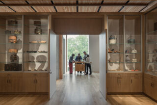 Interior museum exhibit with light wood