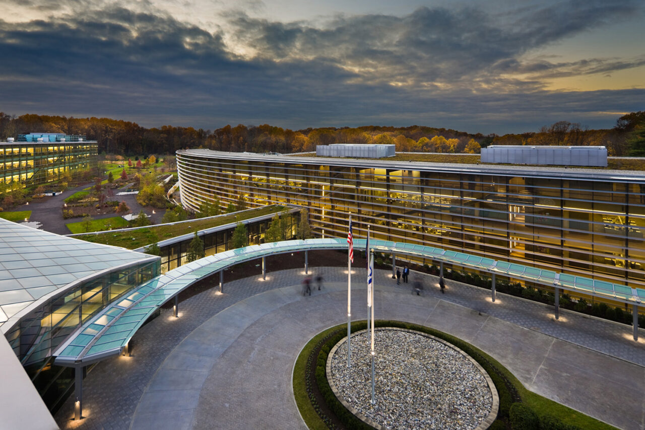 Aerial view of a curved courtyard between building expansions.