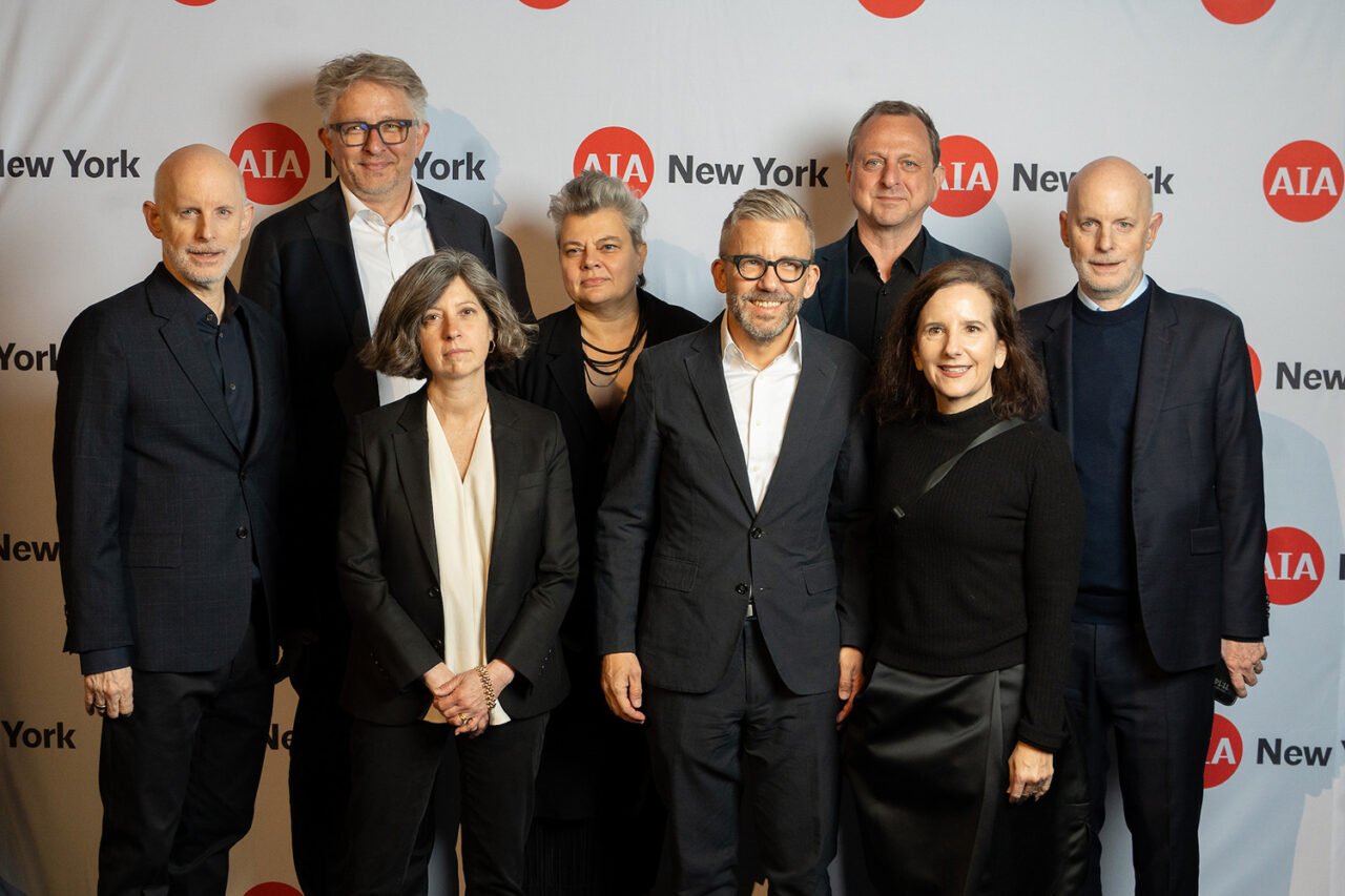 Luncheon honorees stand at the AIA New York step and repeat.