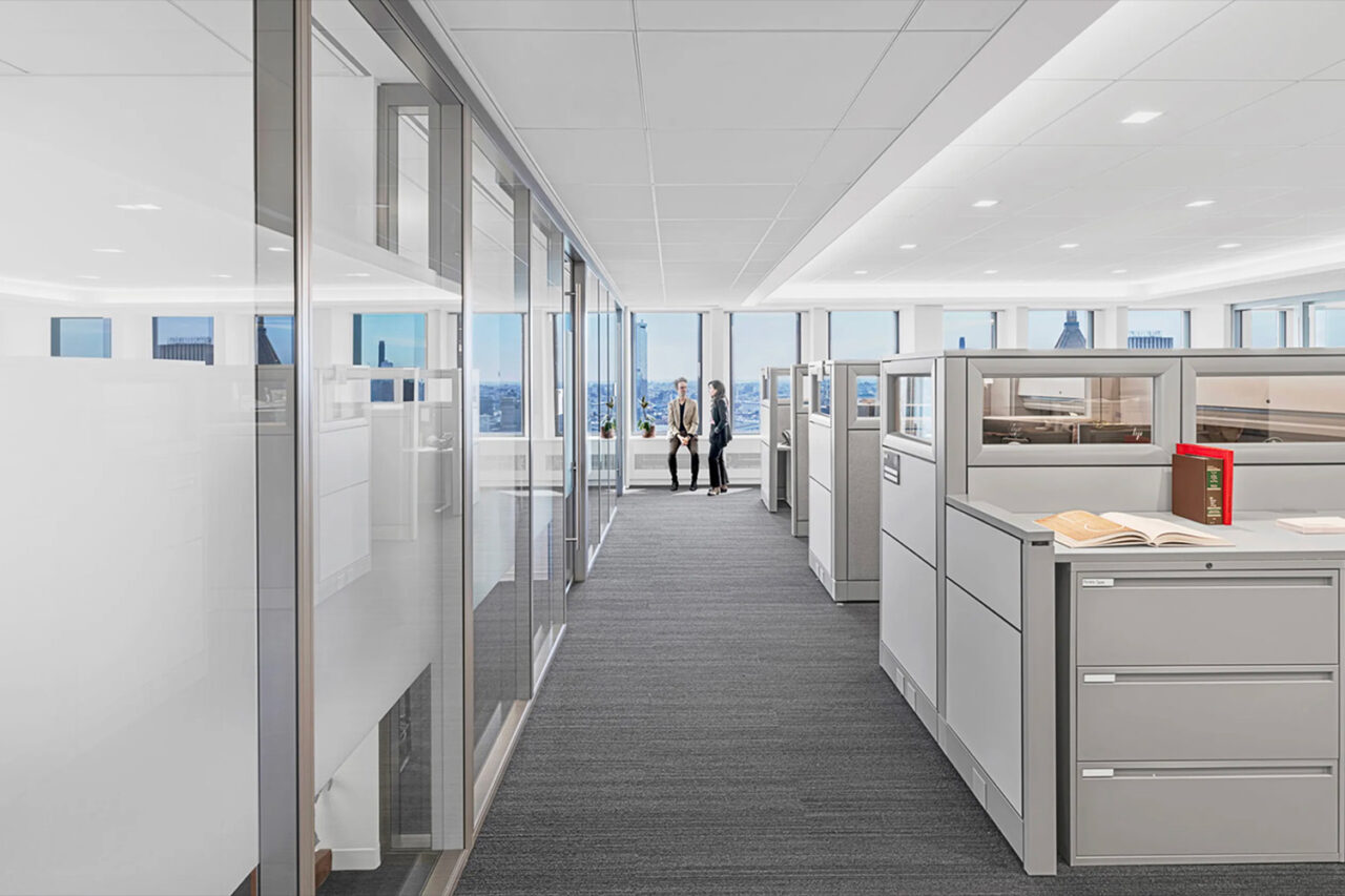 Office interior with a city view in the background.