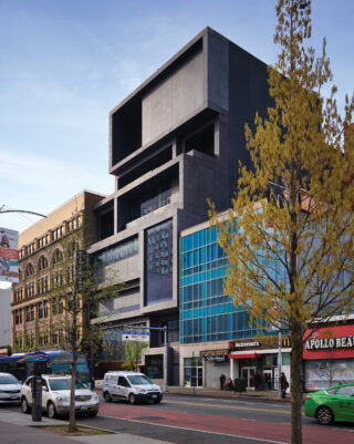 The museum’s stacked volumes are clad in precast concrete with generous glazing