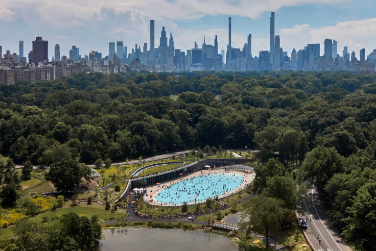 Aerial view of site with city backdrop looking south.