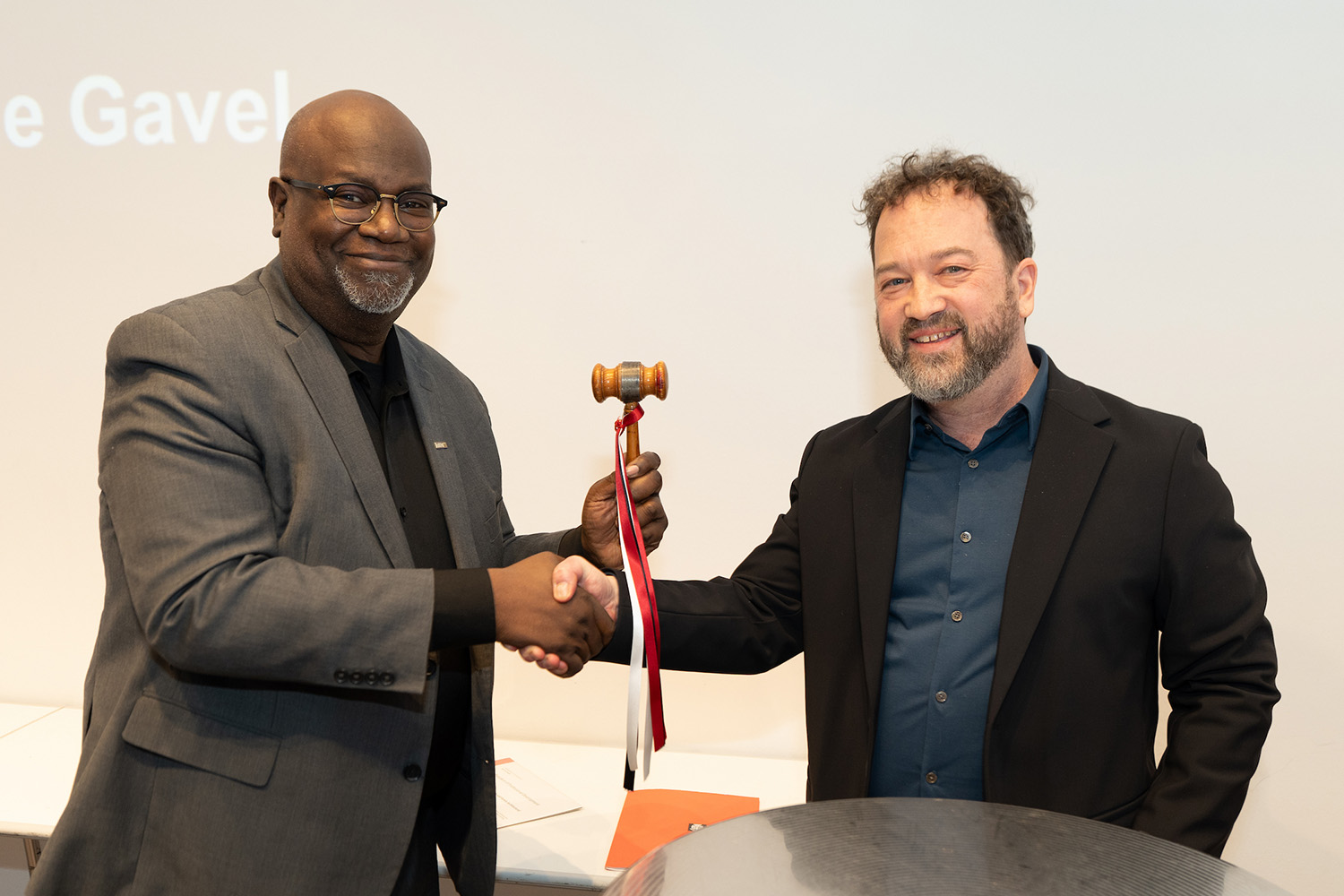 The passing of the gavel from 2025 AIANY President Benjamin Gilmartin, AIA, to 2026 AIANY President Mark Gardner, AIA, NOMA. Photo: Samuel Lahoz.