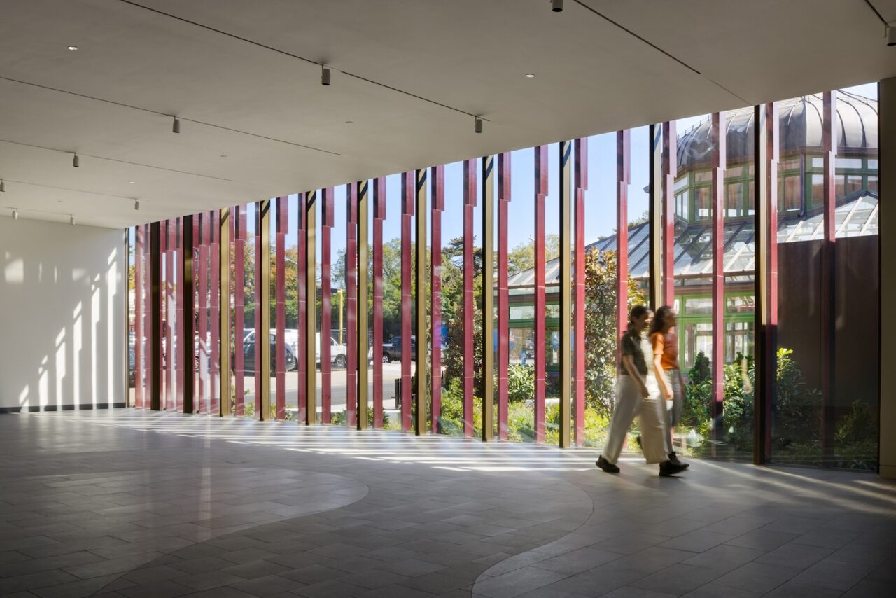 The terracotta clad façade acts as a rainscreen while admitting light and revealing views of the renovated Green-House
