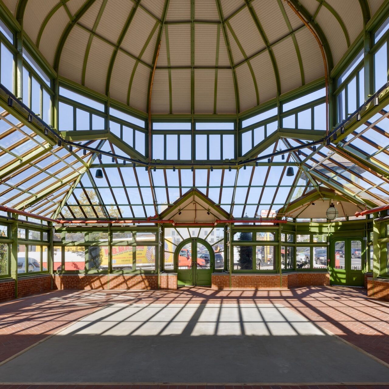 a new copper-and-glass sloped roof and repaired or replaced existing wood windows and doors, all of which were deteriorated and leaking. The floor features a tiled map of the cemetery.