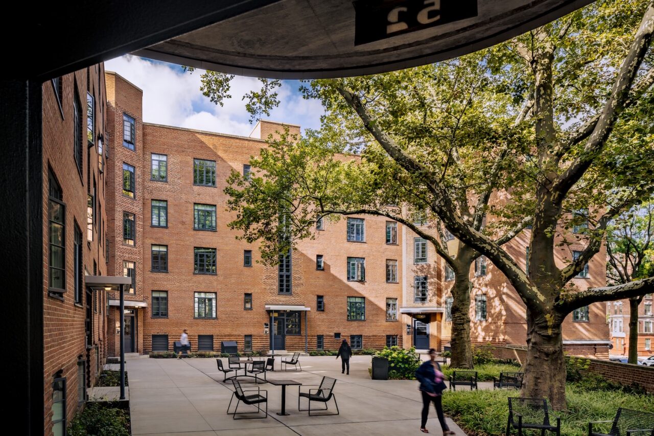 Renewed public outdoor spaces and landscaping were part of the overhaul  at Harlem River Houses, New York  City’s first purpose-built public housing development, completed in 1937. Prior to the renovation, the courtyards and outdoor spaces had suffered from decades of neglect. Photo: Alex Severin.