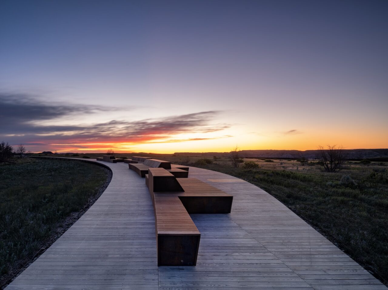 A walkway at the Theodore Roosevelt Presidential Library at sunset