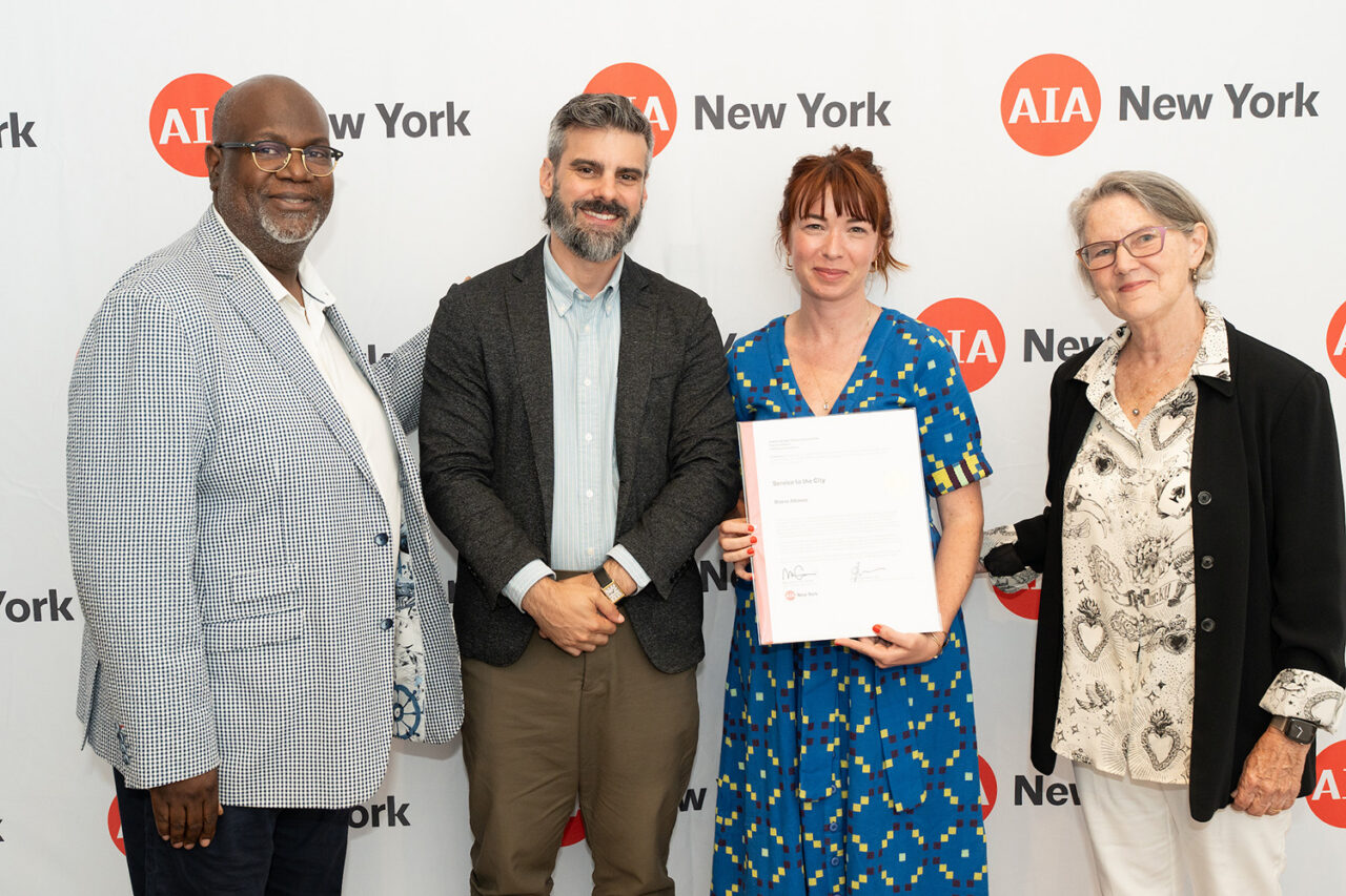 AIANY Executive Director Jesse Lazar, Assoc. AIA and AIANY President Mark Gardner, AIA, NOMA, awards Riders Alliance the Service to the City award. Photo: Samuel Lahoz.