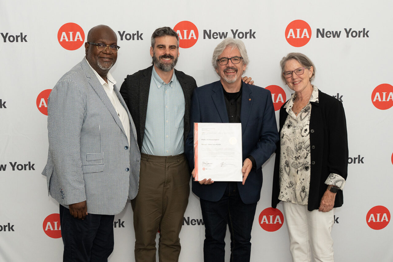 AIANY Executive Director Jesse Lazar, Assoc. AIA and AIANY President Mark Gardner, AIA, NOMA, awards Thomas L. Grassi, FAIA, NCARB, the Public Architect Award. Photo: Samuel Lahoz.