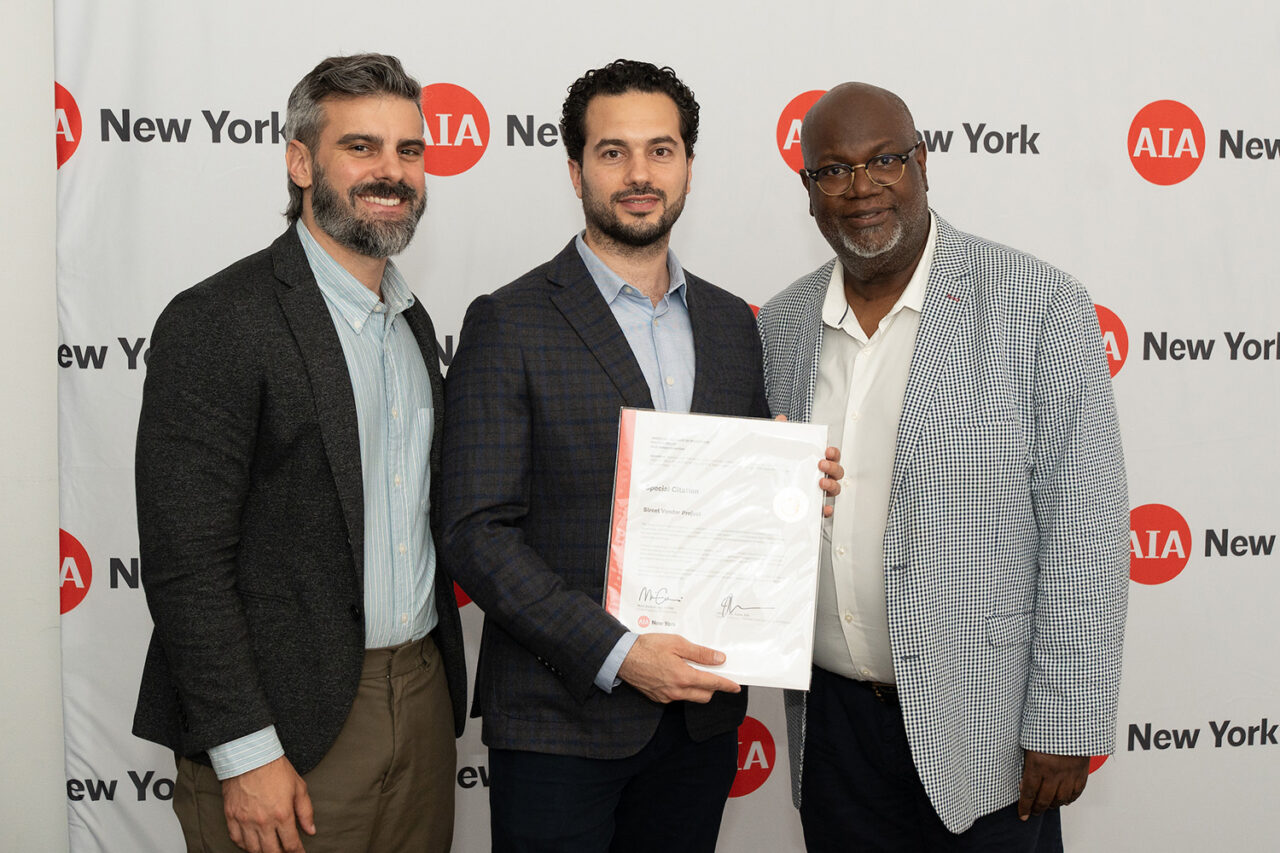 AIANY Executive Director Jesse Lazar, Assoc. AIA and AIANY President Mark Gardner, AIA, NOMA, awards the Street Vendor Project a Special Citation. Photo: Sam Lahoz.