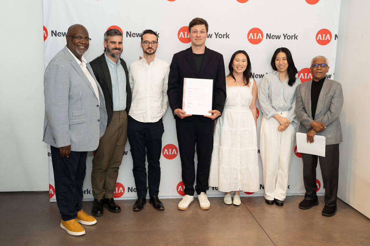 AIANY Executive Director Jesse Lazar, Assoc. AIA and AIANY President Mark Gardner, AIA, NOMA, awards the TORCH Mentorship Program the Service to the Institute Award. Photo: Samuel Lahoz.