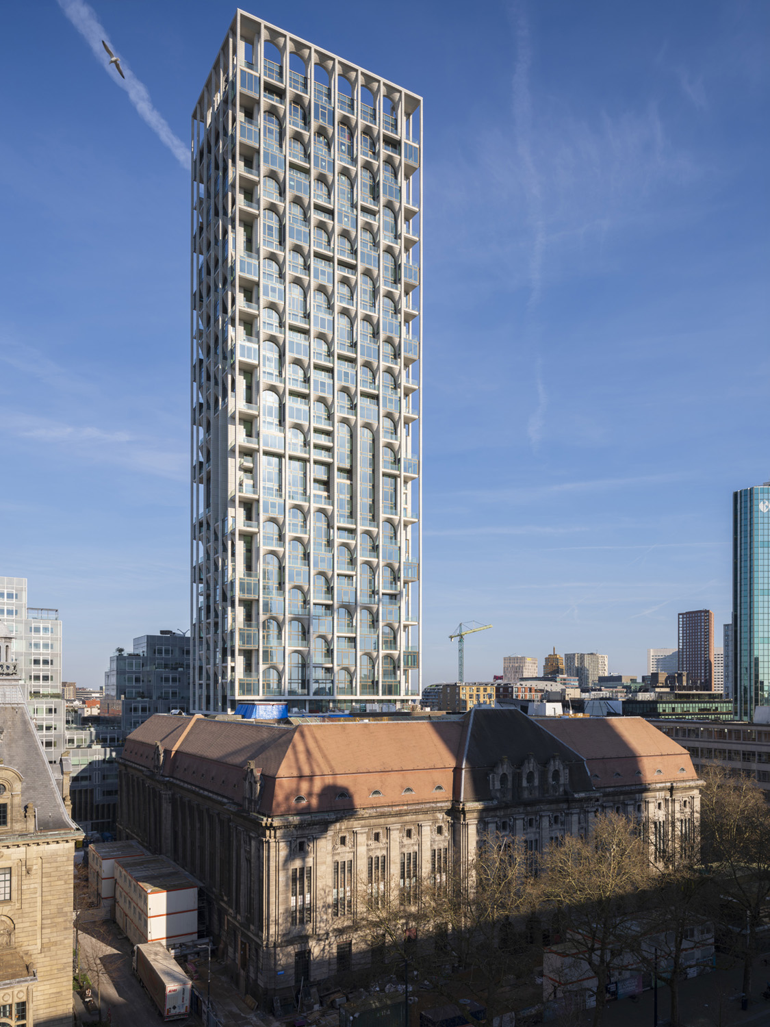 POST by ODA and Omnam Group behind the tower of Rotterdam’s former Central Post Office. Photo: Ossip van Duivenbode.