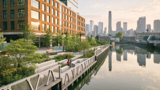 a picnic grove, a sculptural playscape, and a series of paths and seating areas that bring pedestrians close to the waterfront