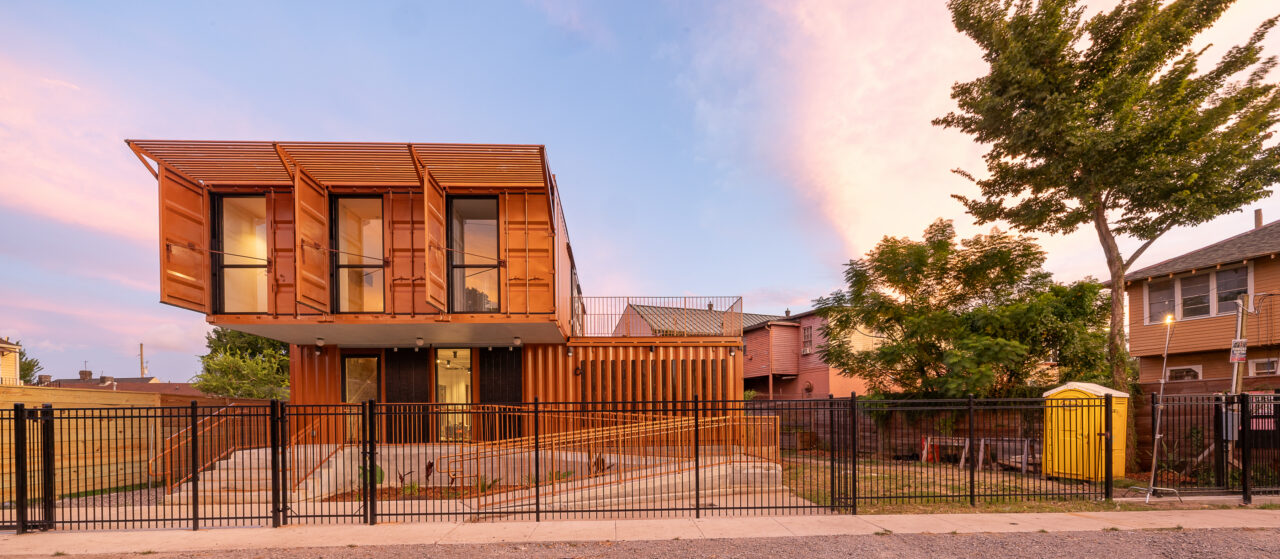 Exterior of a school house with striking contemporary architecture, seen at street level