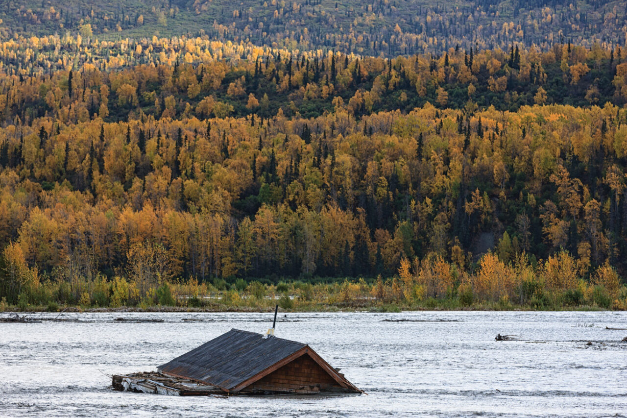 View of bloated house in Matanuska River, Alaska, USA