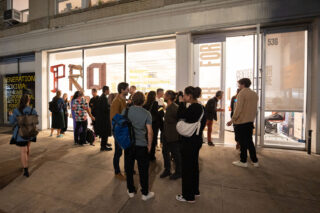 Exhibition opening night at the Center for Architecture, view of the exterior of the building with a crowd of people
