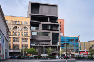 Exterior view of the Studio Museum and the buildings on either side, seen from the street