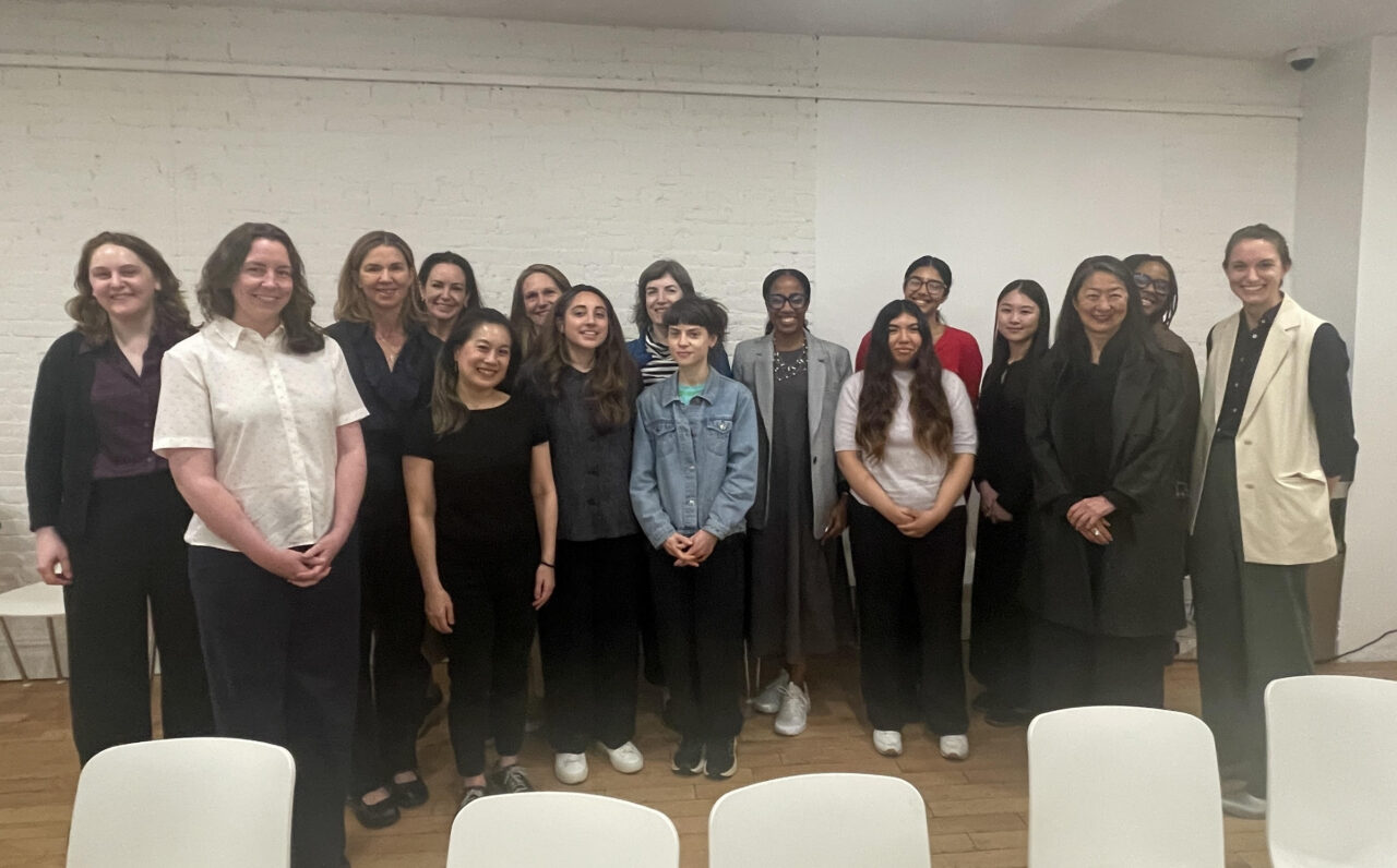 Group photo of panelists and attendees.