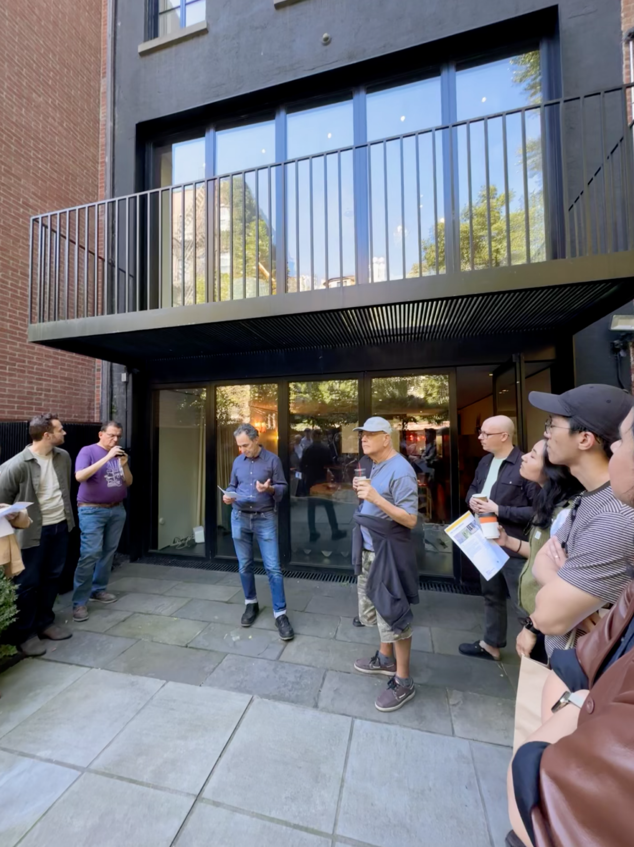 Stephen Moser, AIA, Co-Chair of AIANY CORA, welcomes participants in the rear yard of 8 St. Luke’s Place.Photo: Natalie Chen